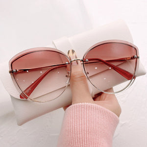 Women's Alloy Frame Rimless Cat Eye Pattern Trendy Sunglasses